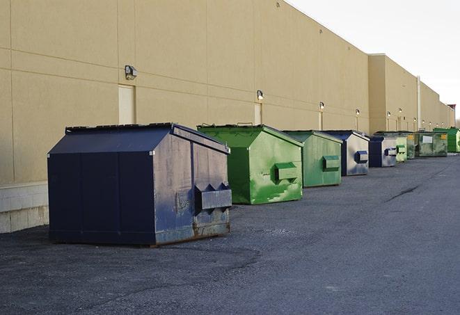 red and green waste bins at a building project in Clements